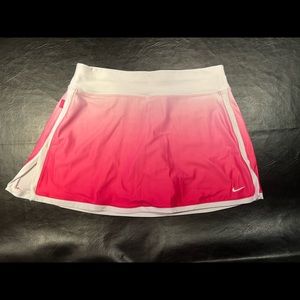 Nike Women’s Tennis Skort. Pink fade with pink shorts under. Medium